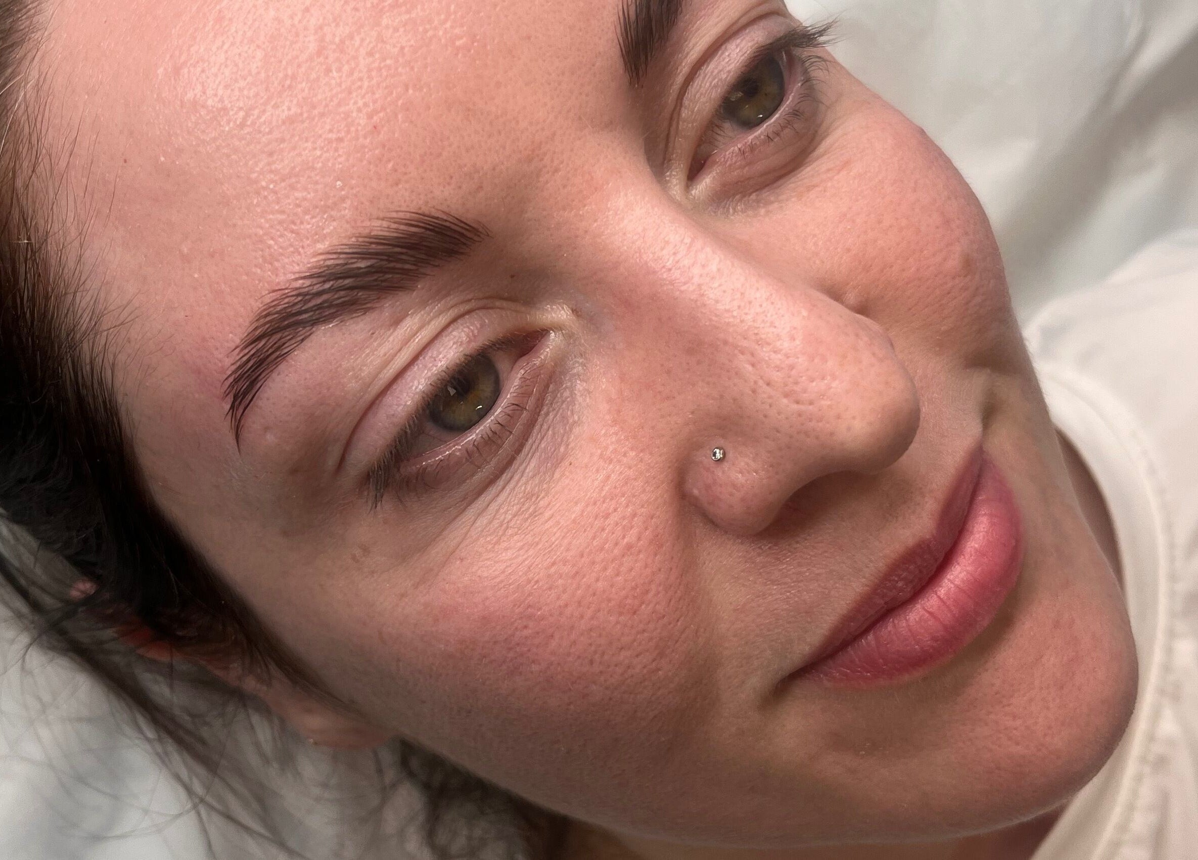 Close-up of a woman with radiant skin after treatment at Natural Aesthetics, Stoke-on-Trent, England, GB.