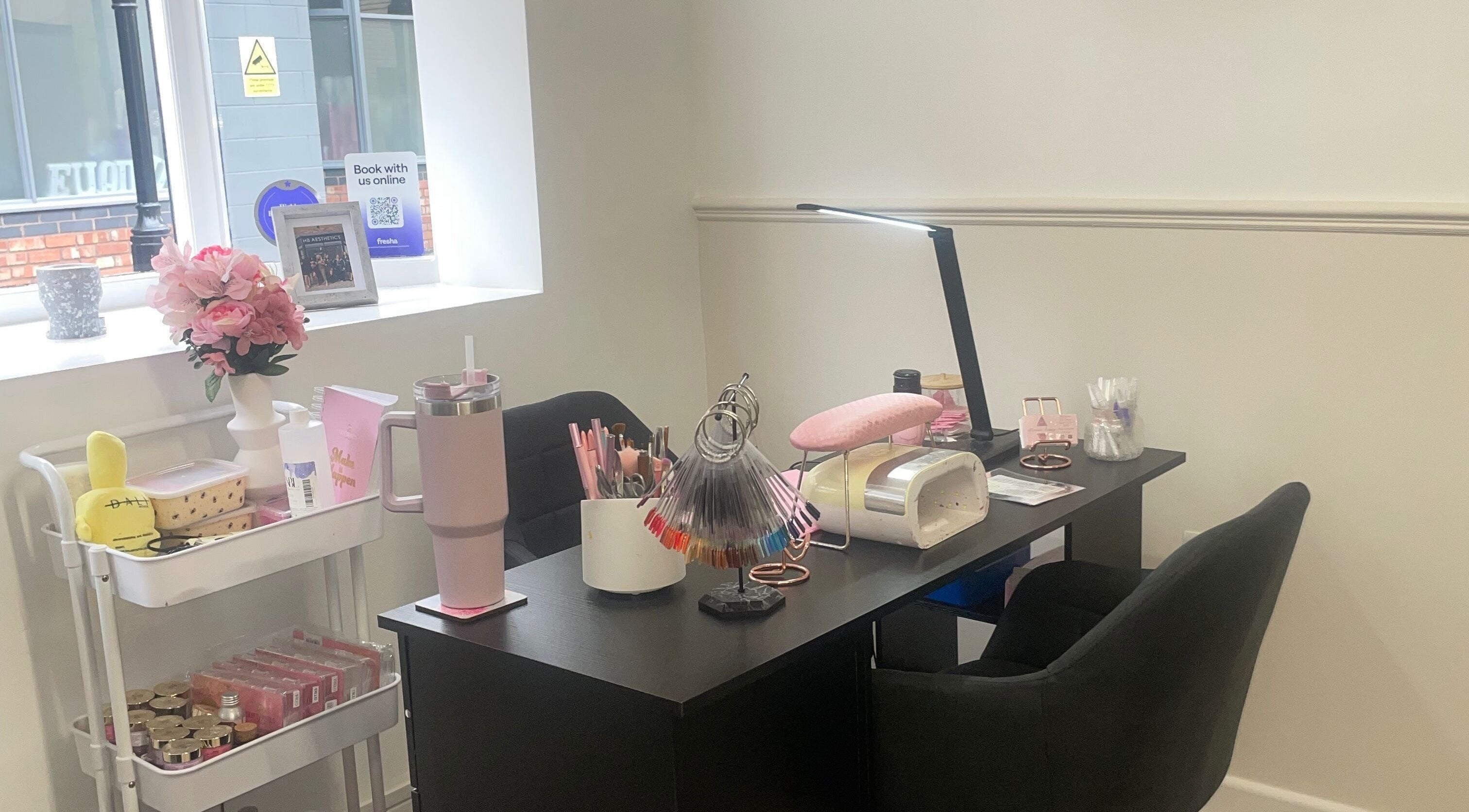 Cozy nail station at Rewrew Beauty in Cannock, England, GB with tools and decor enhancing client experience.