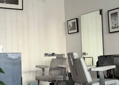 Chic barber chair at Brother Wolf St Kilda, Melbourne, Victoria, AU. Minimalist design for a premium experience.