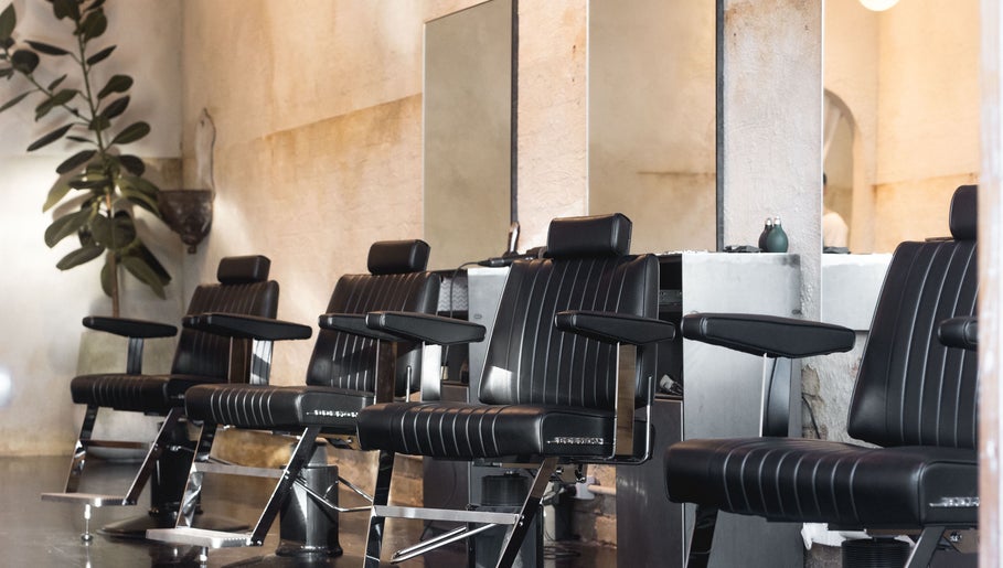 Modern barber chairs at Brother Wolf Fitzroy in Melbourne, Victoria, AU, showcasing a stylish interior.