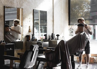Stylish interior of Brother Wolf Fitzroy, Melbourne, Victoria, AU, showcasing expert barbering services.