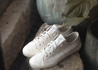 Casual white sneakers on display at Brother Wolf Fitzroy, Melbourne, Victoria, AU, adding a laid-back vibe.