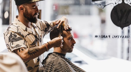 Barber styling hair at Brother Wolf Prahran, Prahran, Victoria, AU, perfect grooming experience.