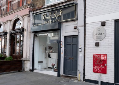 Front view of Brick Lane Nail Spa in London, England, GB, showcasing elegant storefront design.