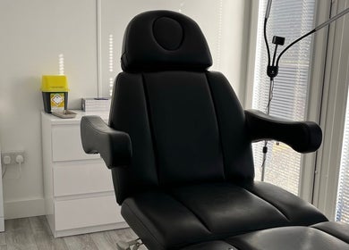Modern black treatment chair at Nurse Injector Michelle, Lowestoft, England, GB. Sleek and inviting.