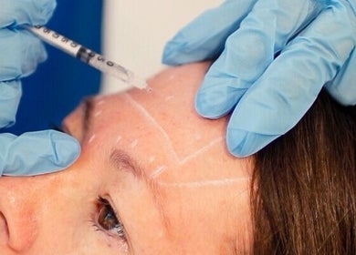 Nurse Injector Michelle performing a forehead injection at Lowestoft, England, GB wellness venue.
