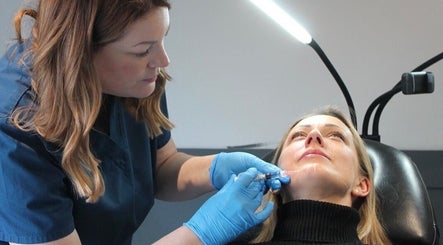 Nurse Injector Michelle demonstrates expert care in Lowestoft, England, GB facial treatment procedure.