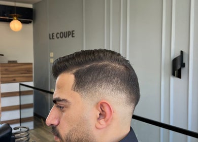 Person with sleek sidecut at Le Coupe 3, عمّان, محافظة العاصمة, JO, showcasing modern salon interior.