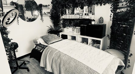 Relaxing treatment room at Sie Skin Spa in Stalybridge, England, GB adorned with lush greenery.