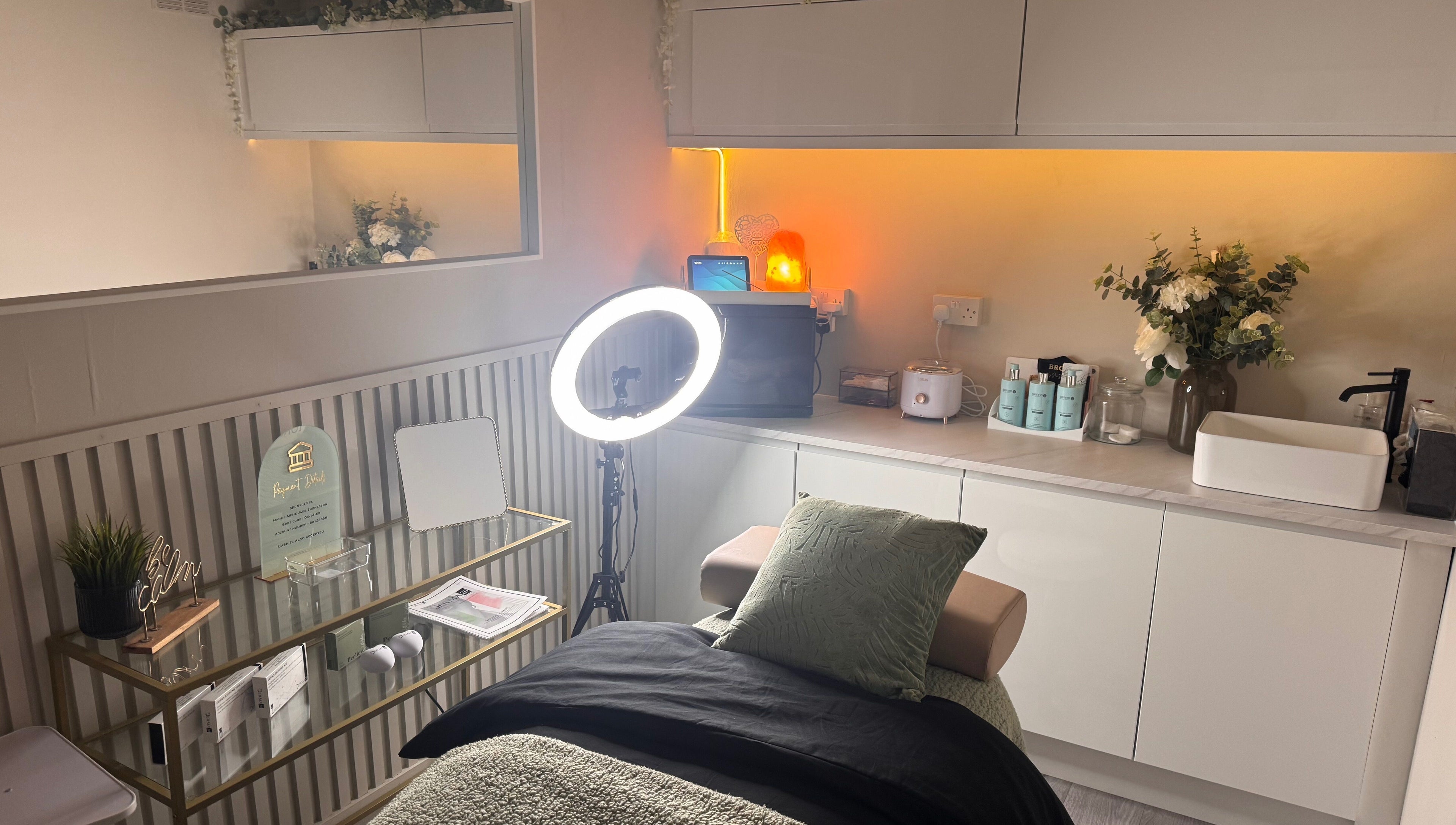 Modern beauty treatment room at Sie Skin Spa, Stalybridge, England, GB with elegant decor and warm lighting.