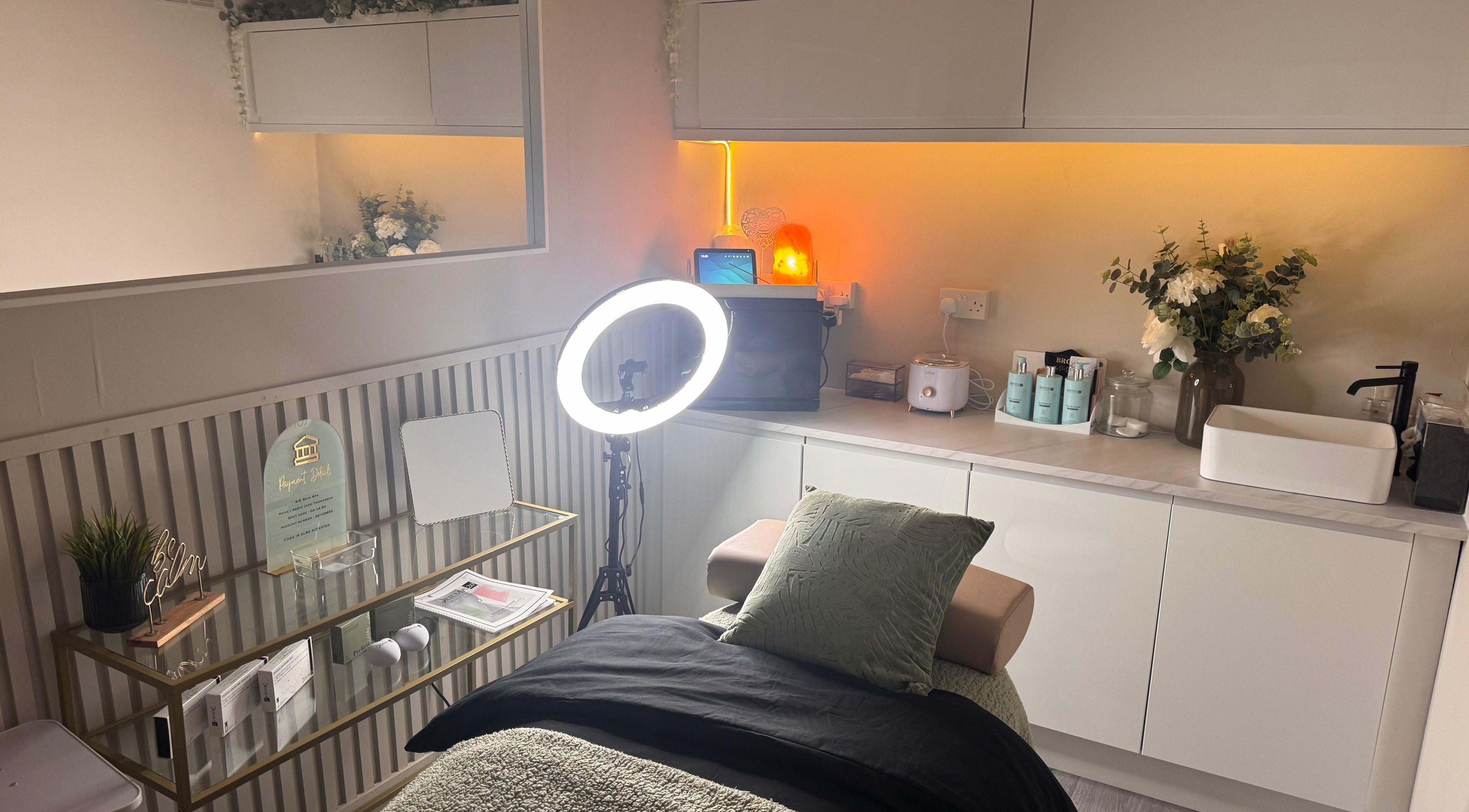 Modern beauty treatment room at Sie Skin Spa, Stalybridge, England, GB with elegant decor and warm lighting.