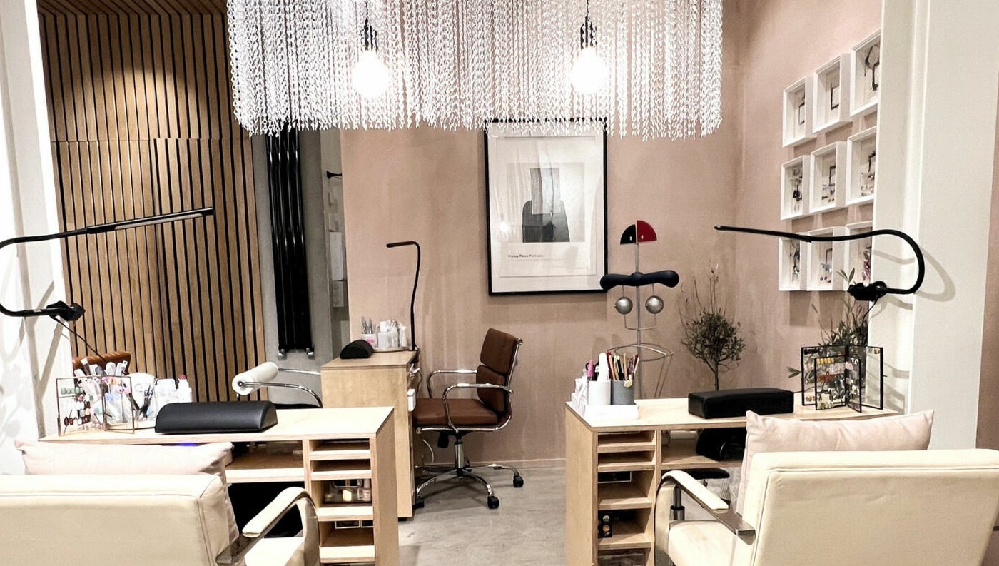 Elegant nail salon interior at Haco 箱 Nails, London, England, GB, showcasing modern decor and comfortable seating.
