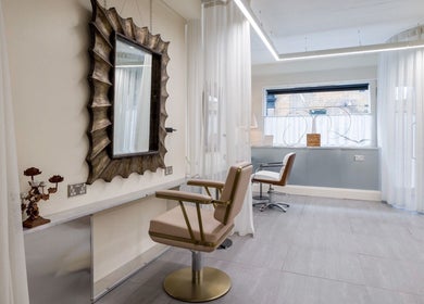 Elegant hair salon space at Haco 箱 Hair + Nails Hoxton, London, England, GB with stylish decor and lighting.