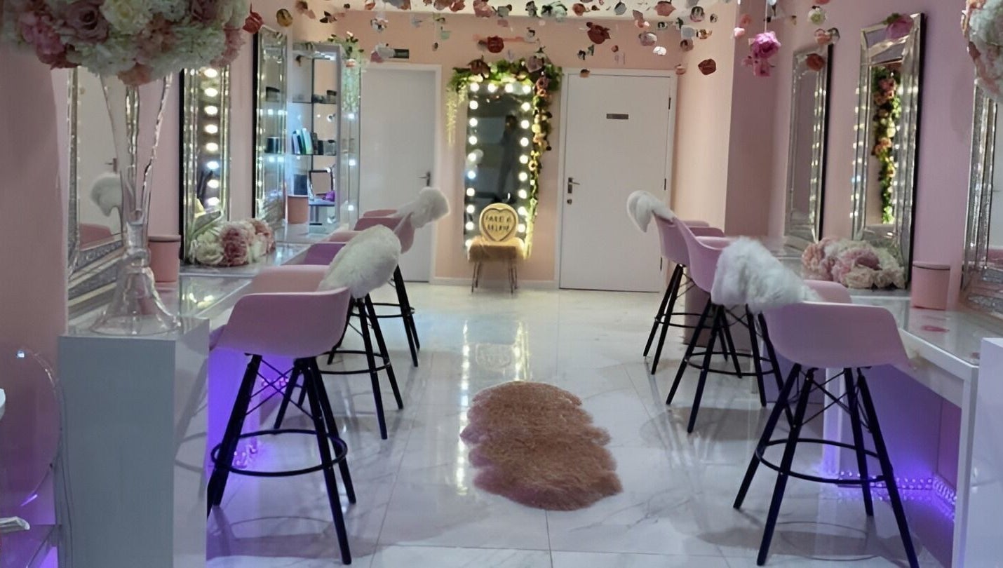 Elegant interior of Makeup Mobile To You Studio in Stockport, England, GB with pink decor and floral accents.