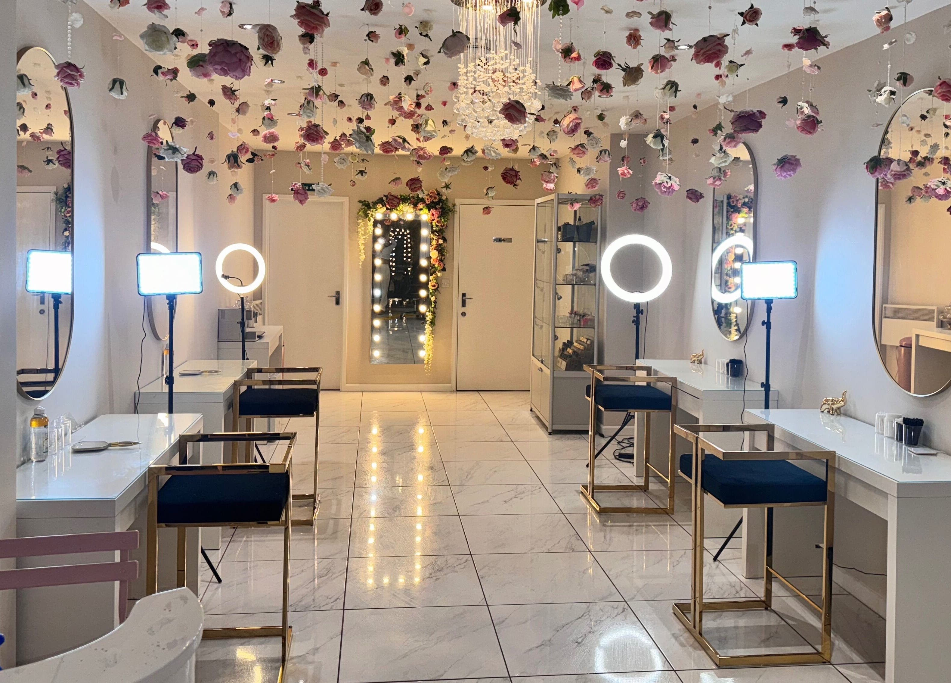 Glamorous interior of Makeup Mobile To You Studio in Stockport, England, GB with hanging florals and elegant seating.