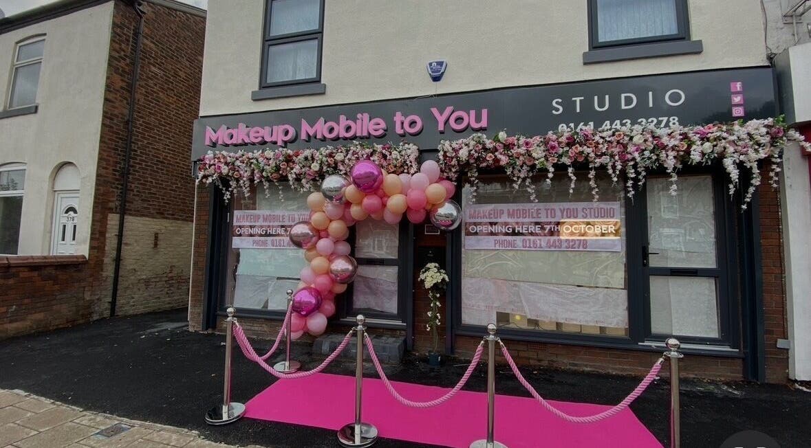 Chic entrance of Makeup Mobile To You Studio in Stockport, England, GB, adorned with vibrant pink decor.