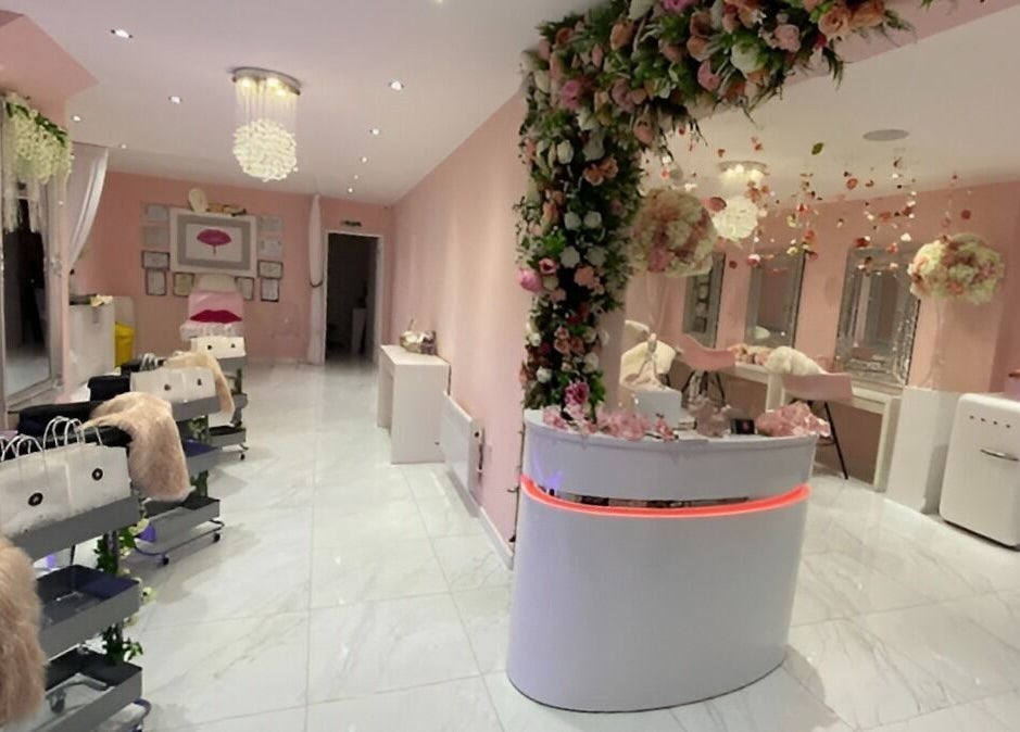 Chic interior of Makeup Mobile To You Studio in Stockport, England with floral decor and beauty stations.