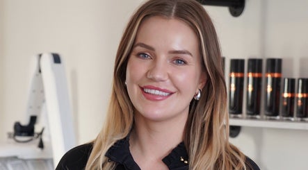 Smiling staff member at Skin Wellness Clinic in HIGHETT, Victoria, AU, enhancing the welcoming atmosphere.