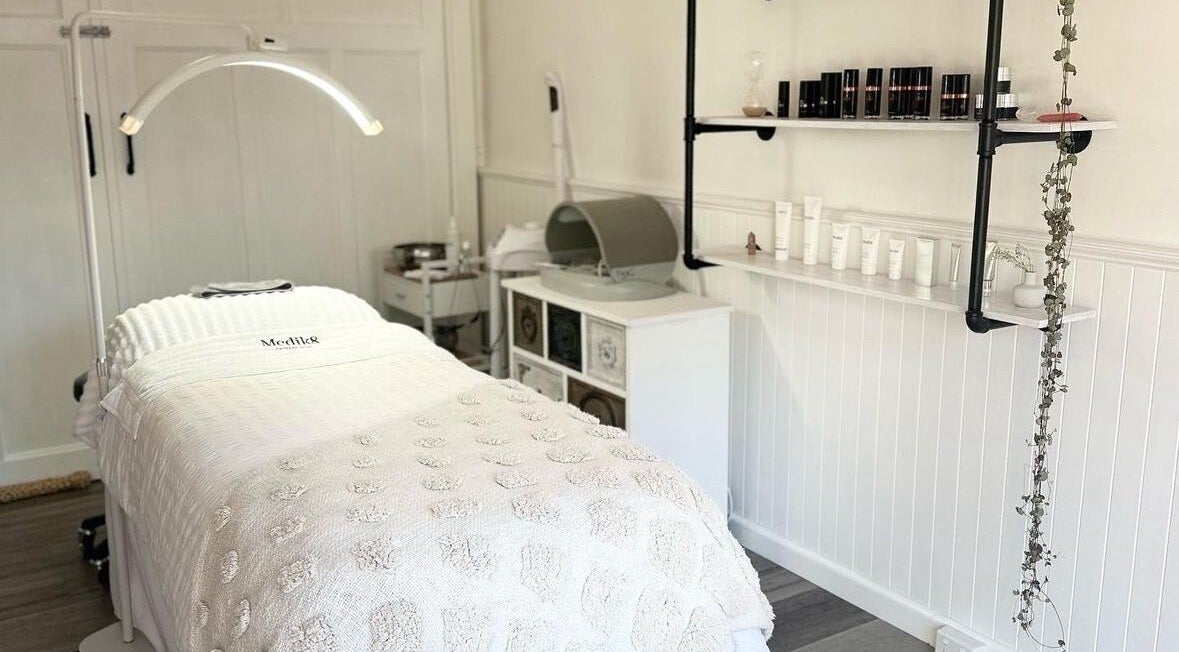 Relaxing treatment room at Skin Wellness Clinic, Highett, Victoria, AU, featuring a spa bed and skincare products.