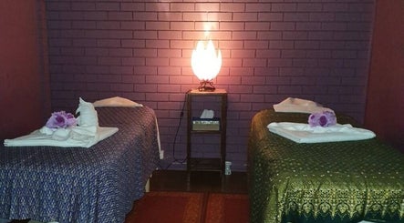 Tranquil massage room at Smiling Thai Therapy & Massage, Wynnum, Queensland, AU with soft lighting and cozy beds.