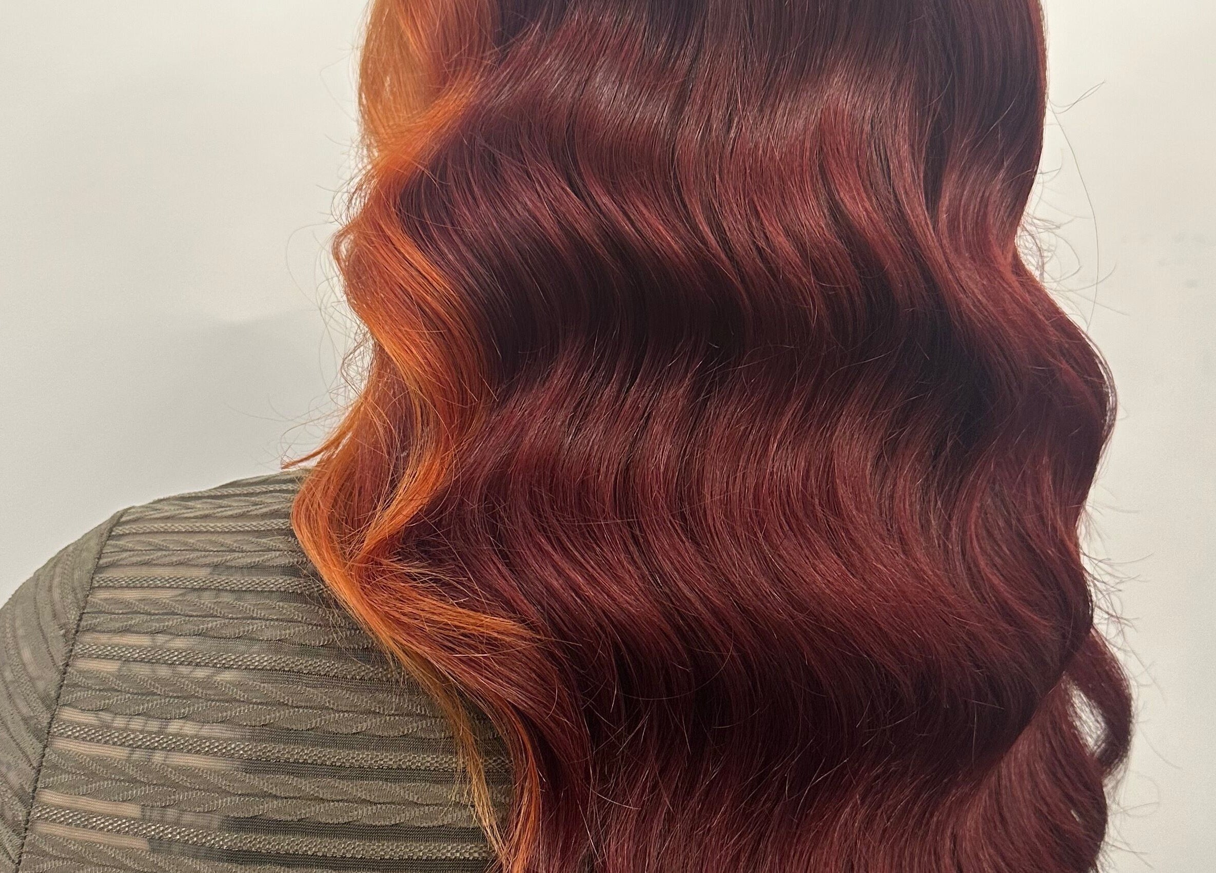 Rich, wavy hair in vibrant copper tones at Lush Hair and Nails, Stockton on Tees, England, GB.