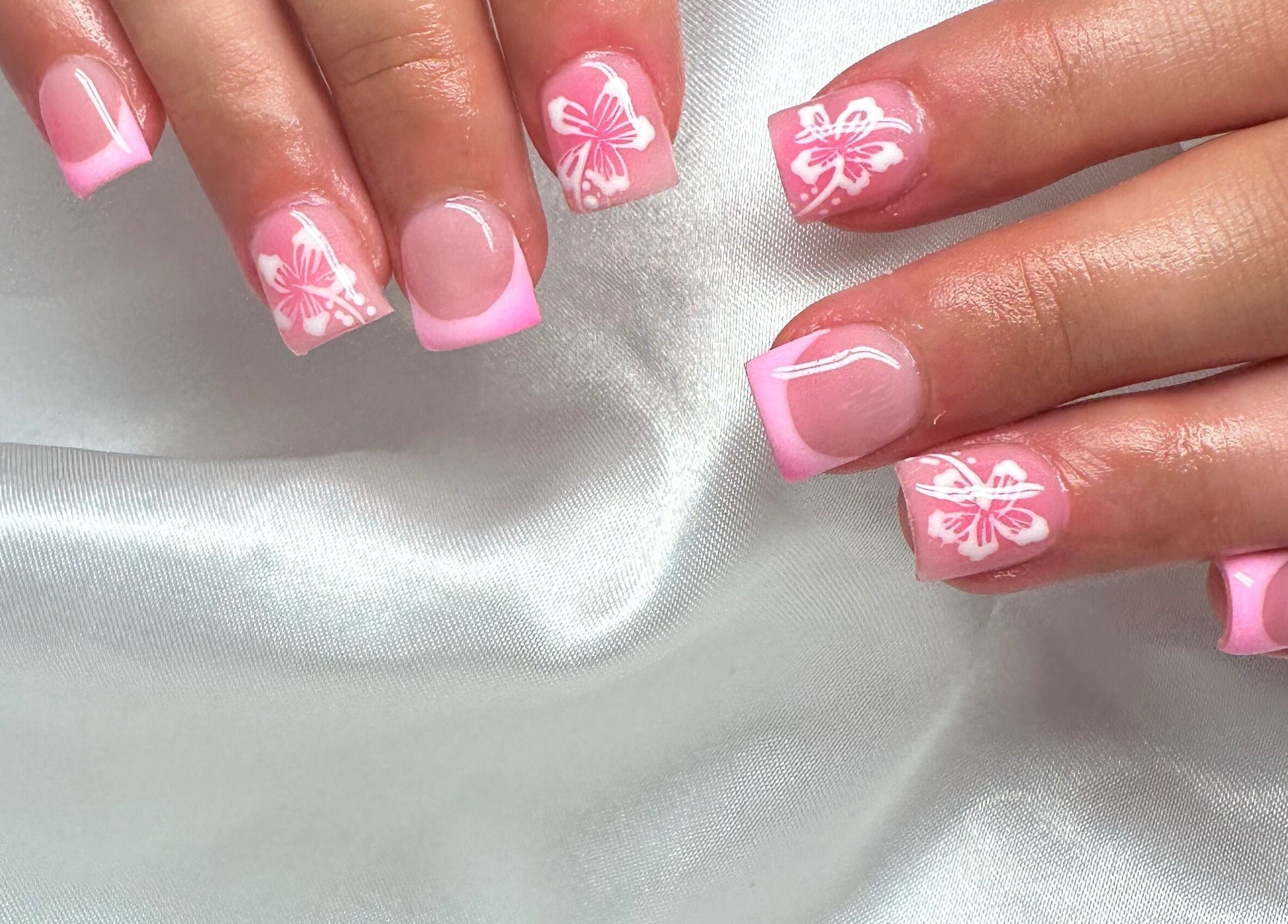 Elegant pink nails with floral design at Lush Hair and Nails, Stockton on Tees, England, GB.