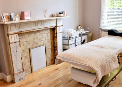 Elegant treatment room at The London Road Clinic in Newark-on-Trent, England, GB with a massage bed and calm decor.