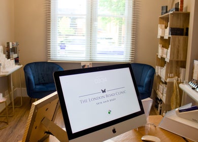 Bright and welcoming room at The London Road Clinic, Newark-on-Trent, England with beauty products displayed neatly.