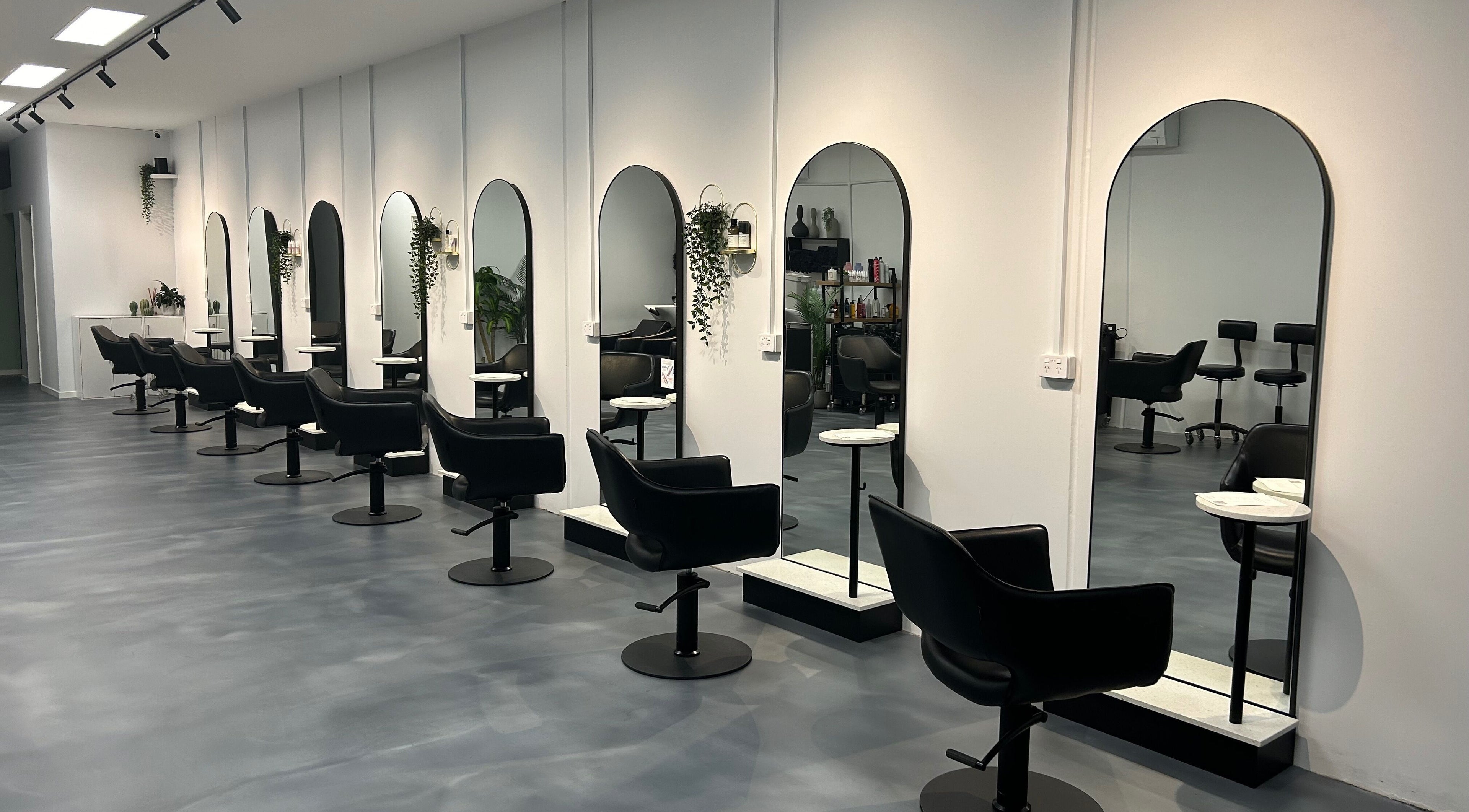 Modern styling chairs and mirrors at Revolutions Hair Studio, Melbourne, Victoria, AU.