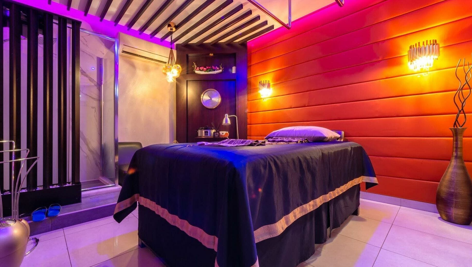 Luxurious massage room at Alafiya Center for Hamam & Saloon, Abu Dhabi, AE with ambient lighting and decor.