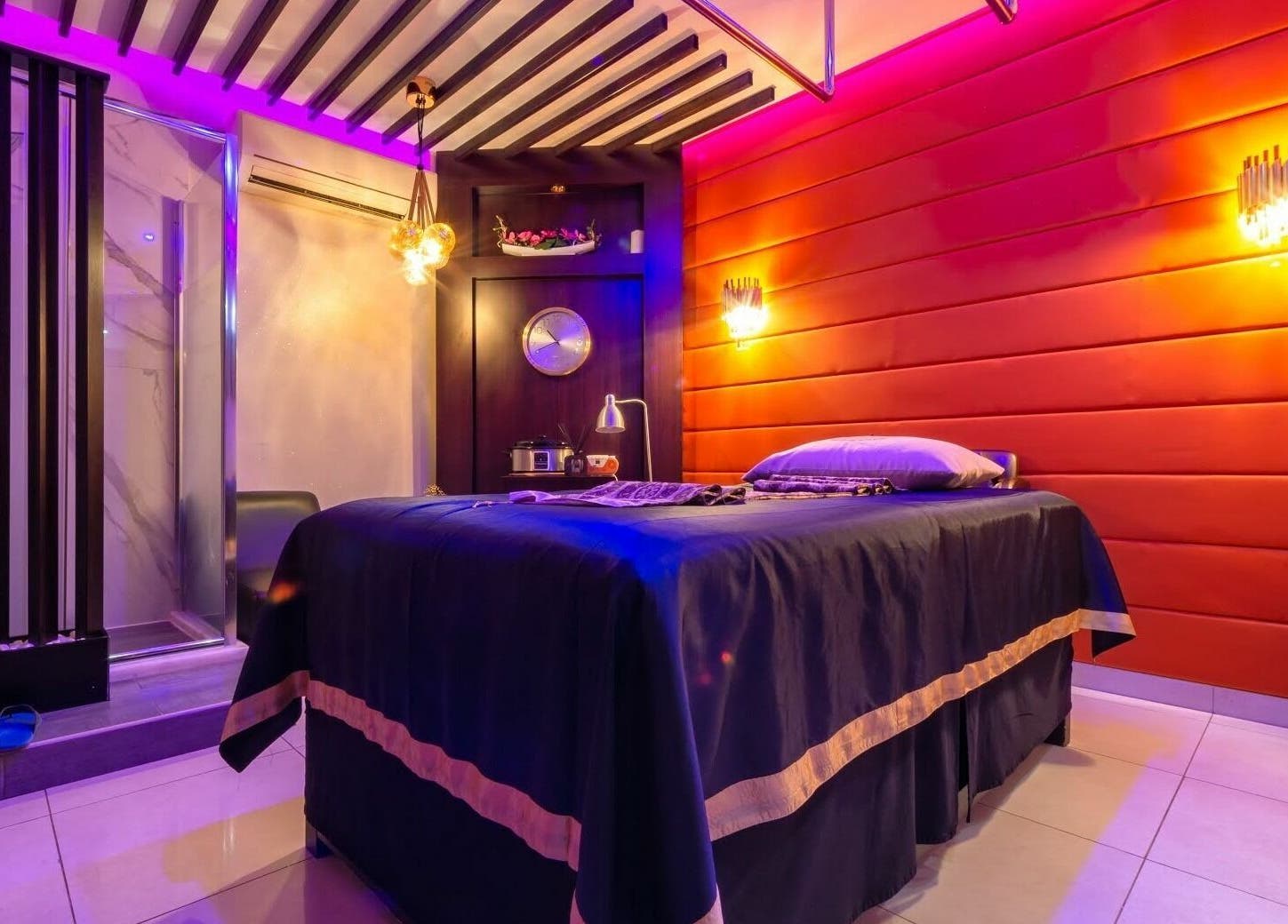 Luxurious massage room at Alafiya Center for Hamam & Saloon, Abu Dhabi, AE with ambient lighting and decor.