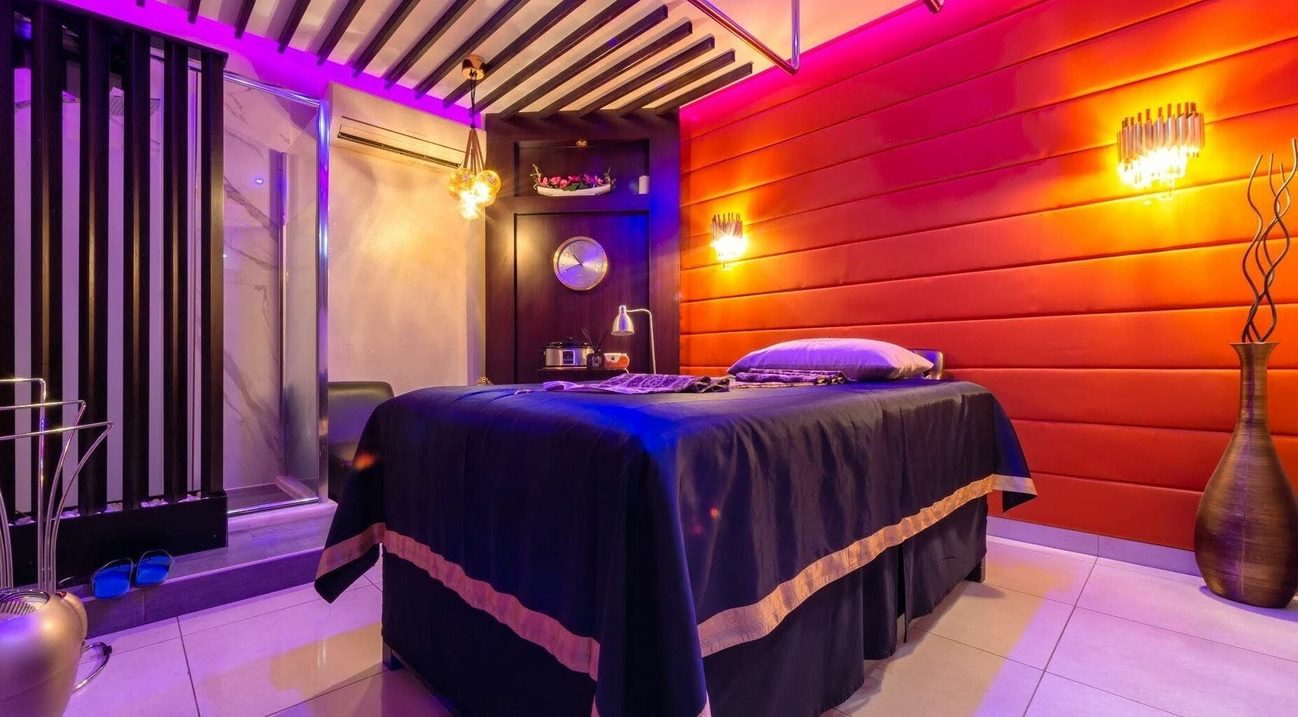 Luxurious massage room at Alafiya Center for Hamam & Saloon, Abu Dhabi, AE with ambient lighting and decor.