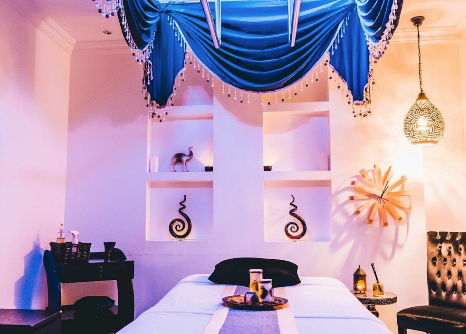 Luxurious treatment room at Alafiya Center for Hamam & Saloon in Abu Dhabi, AE with elegant decor and lighting.