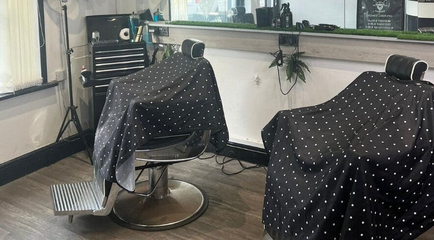 Stylish barber chairs at Herkymoo Herstmonceux, Herstmonceux, England, GB, offering a modern grooming experience.