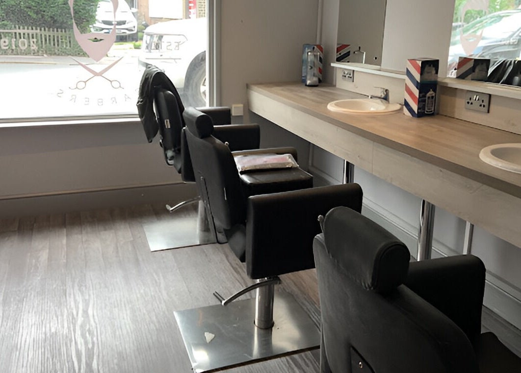 Stylish barber chairs at Herkymoo Herstmonceux in Herstmonceux, England, GB, offering a modern and relaxing atmosphere.