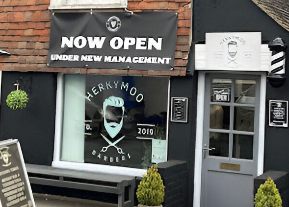 Exterior of Herkymoo Herstmonceux, a charming barbershop in Herstmonceux, England, GB, showcasing a stylish entrance.