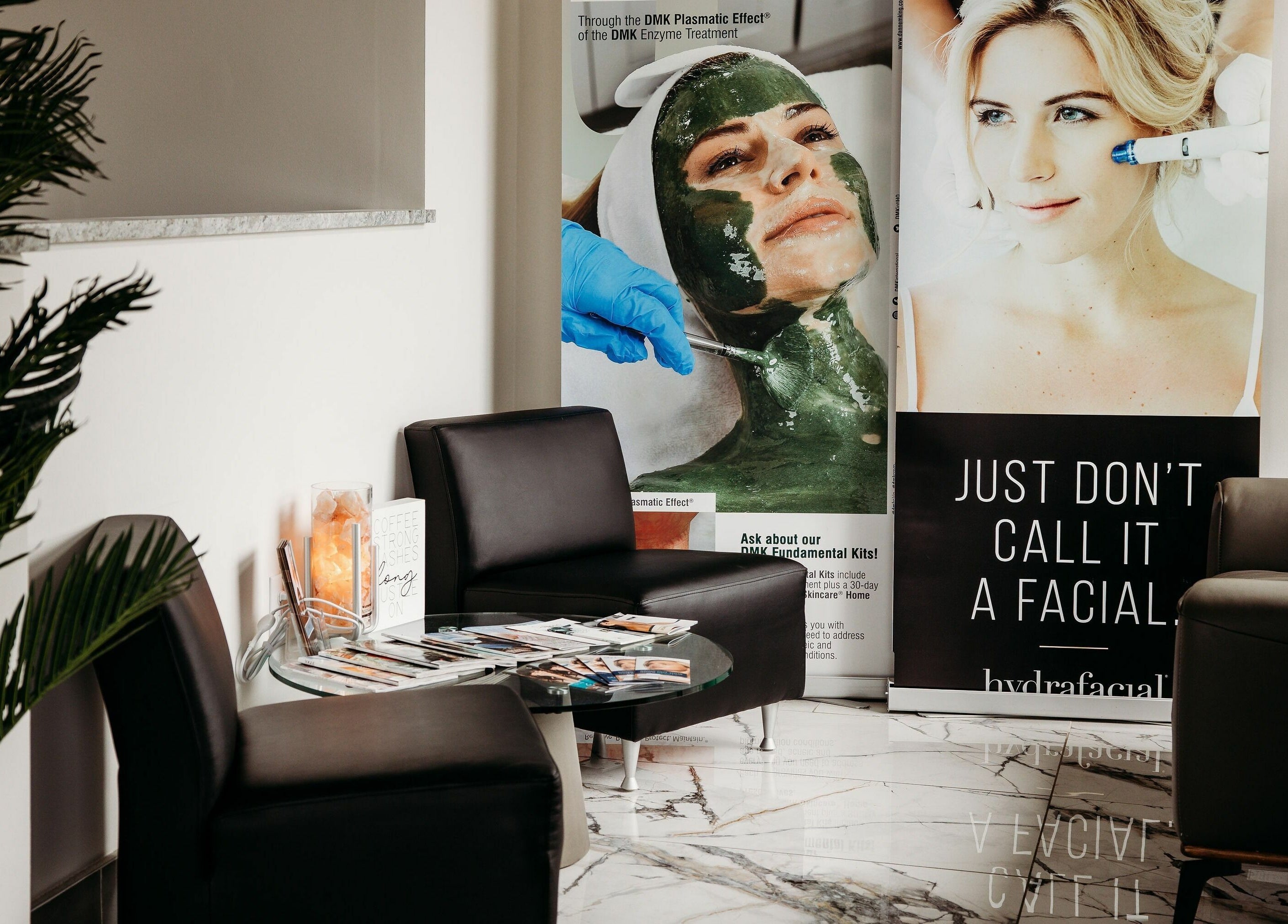 Relaxing seating area at Oceanfront - Vogue Lashes and Spa, Virginia Beach, Virginia, US with beauty posters.