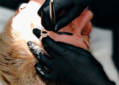 Detail of eyebrow tattooing at Inked Elegance, Randburg, Gauteng, ZA. Expert hands and tools in action.