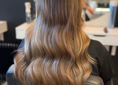 Smooth, wavy brown hair showcased at By.CharleyHulme (Hair), Leeds, England, GB.