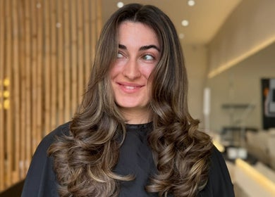 Stylish wavy hair at By.CharleyHulme (Hair) salon in Leeds, England, GB showcasing modern beauty trends.