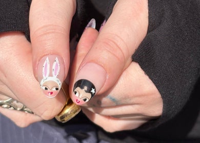 Creative cartoon nail art design by byphoeb in Cardiff, Wales, GB, showcasing unique character illustrations.