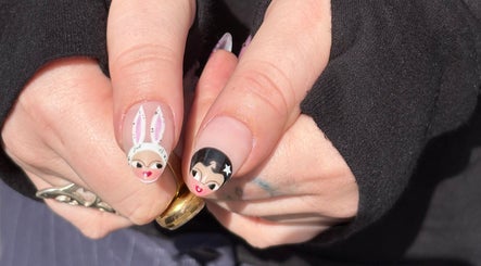 Creative cartoon nail art design by byphoeb in Cardiff, Wales, GB, showcasing unique character illustrations.