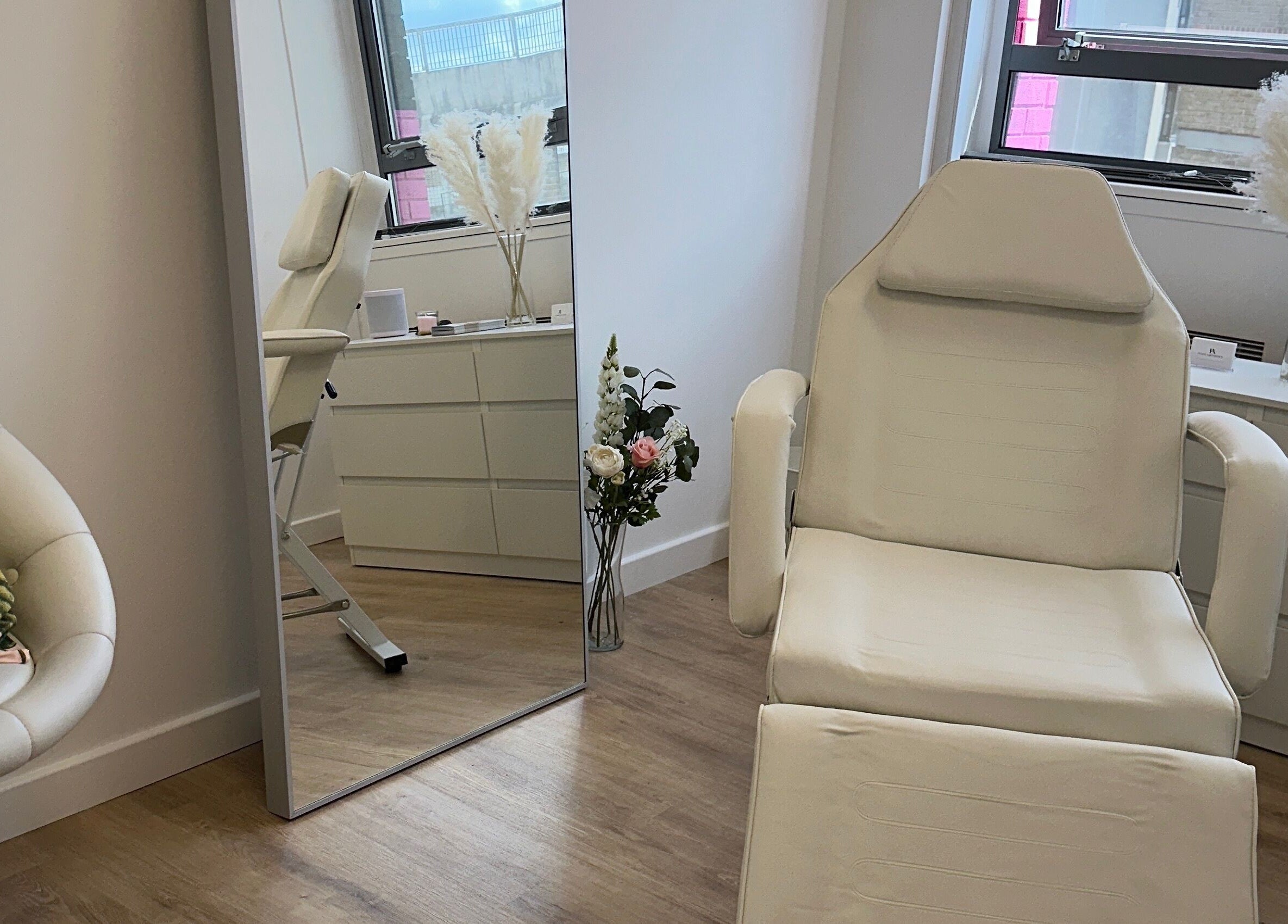Tranquil treatment room at Fleur Aesthetics - East London Clinic in Barking, England, GB, showcasing comfort and style.