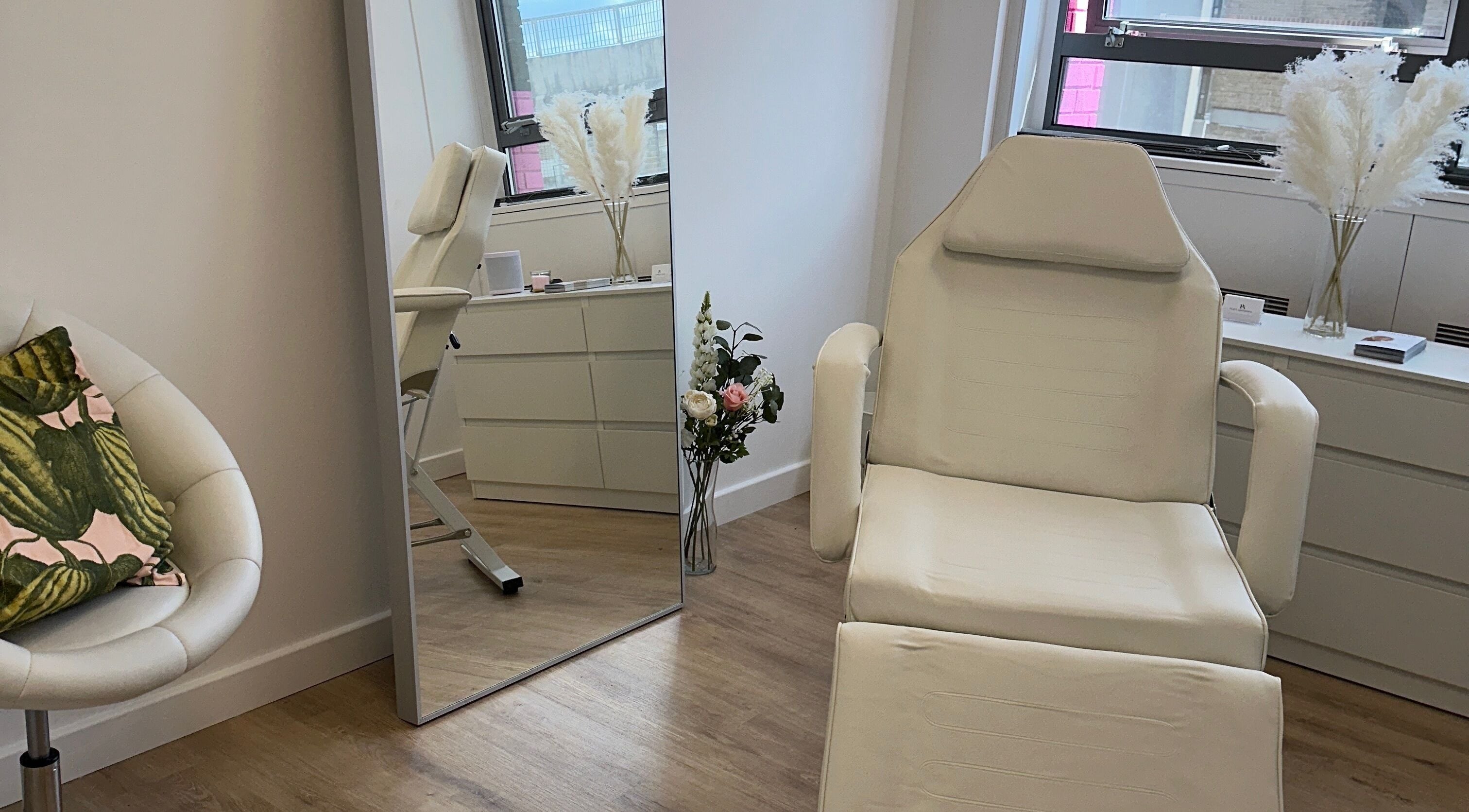 Tranquil treatment room at Fleur Aesthetics - East London Clinic in Barking, England, GB, showcasing comfort and style.