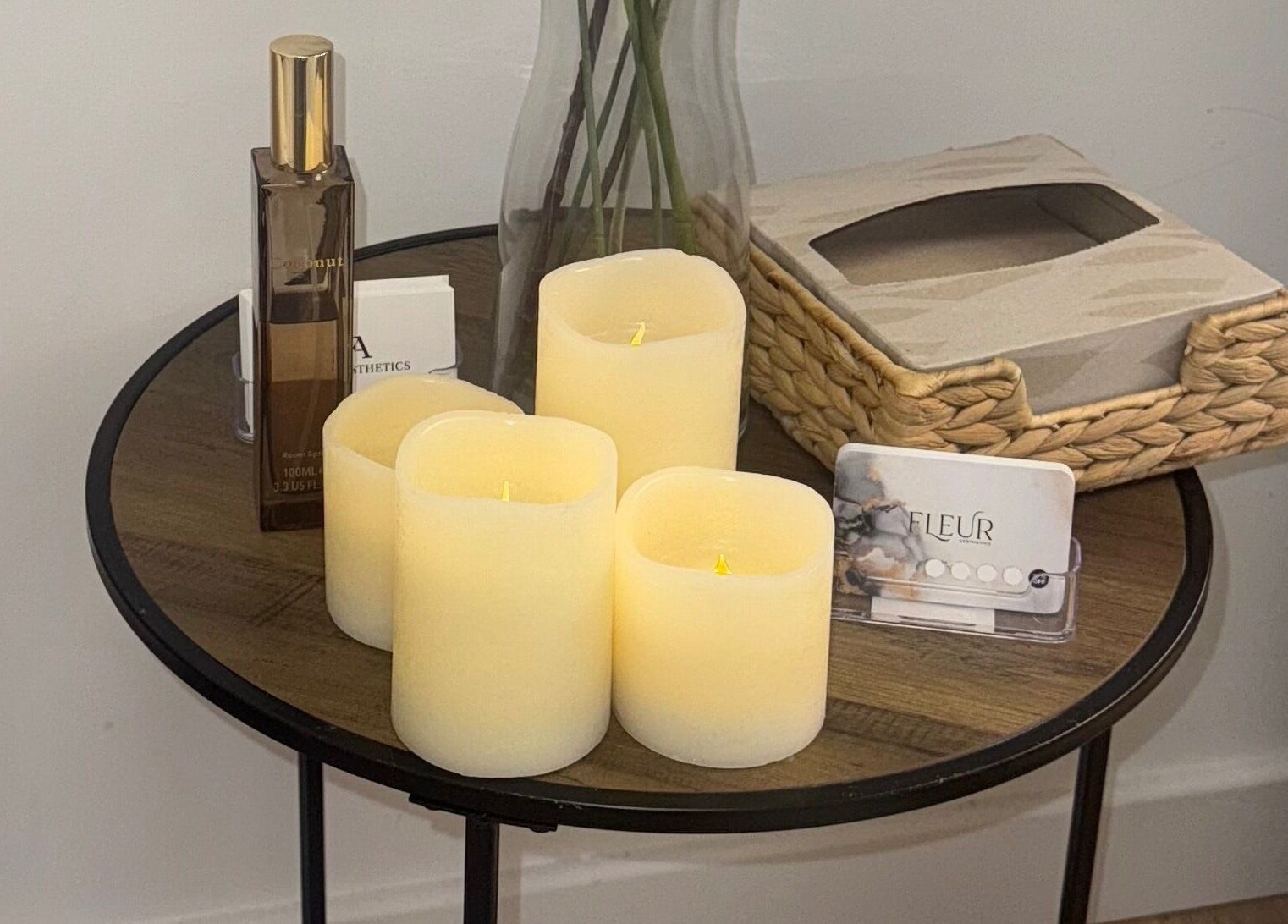 Cozy table decor with candles at Fleur Aesthetics - East London Clinic, Barking, England, GB.