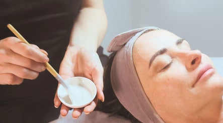 Woman receiving facial treatment at Living Skin Clinic, Merrimac, Queensland, AU.