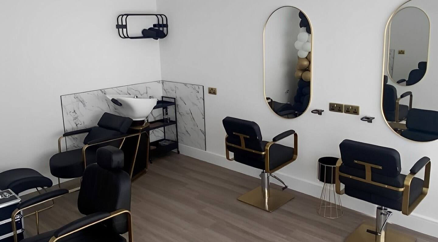 Elegant salon setup at Elite Beauty in Borrowash, England, GB featuring stylish chairs and modern decor.