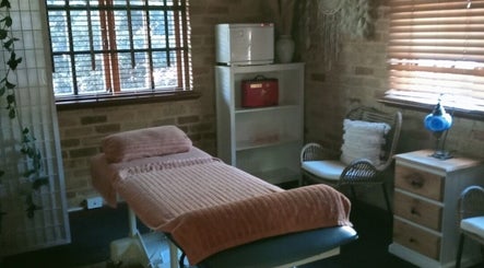Cozy massage room at Recharge Remedial And Sports Massage, Roleystone, Western Australia, AU with calming decor.