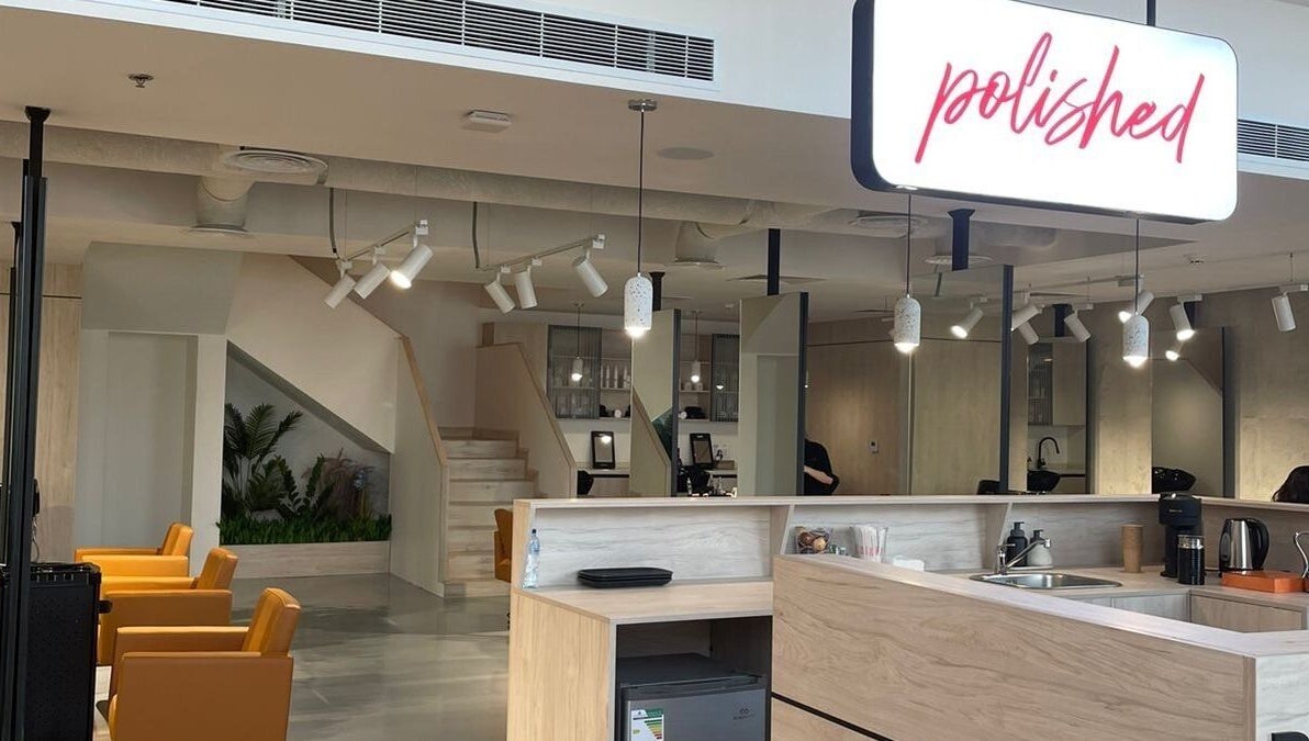 Modern salon interior at Polished, Al Khobar, Eastern Province, SA showcases stylish chairs and elegant decor.