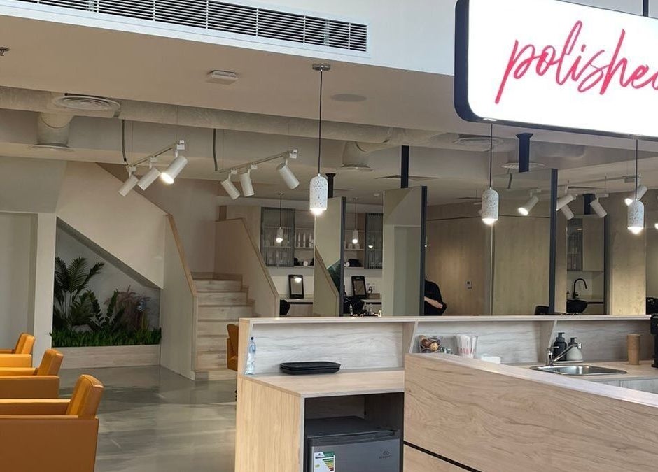 Modern salon interior at Polished, Al Khobar, Eastern Province, SA showcases stylish chairs and elegant decor.